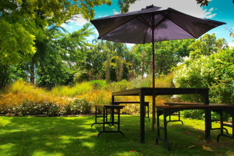 A table and chairs in a park